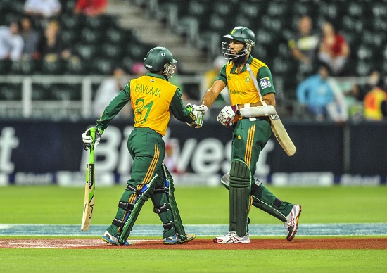 Temba Bavuma of the Proteas congratulates Hashim Amla of the Proteas for his 50 during the 2014 Nelson Mandela Legacy Cup between Proteas and Springboks at the The Wanderers in Johannesburg, South Africa on December 05, 2014 ©Samuel Shivambu/BackpagePix